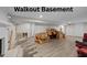 Unfinished walkout basement with new wood floors and room for customization and extra storage at 539 N Oneil St, Clayton, NC 27520