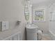 A modern bathroom with a unique sink and vanity, accompanied by a well-lit mirror at 539 N Oneil St, Clayton, NC 27520