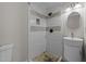 Modern bathroom boasts a tiled shower with mosaic accents, sleek fixtures, and a unique vessel sink at 539 N Oneil St, Clayton, NC 27520