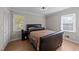 Cozy bedroom with hardwood floors, a comfortable queen-size bed, and ample natural light at 539 N Oneil St, Clayton, NC 27520