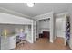 Bright bedroom with a built-in bunk bed, desk, hardwood floors, and ample storage space at 539 N Oneil St, Clayton, NC 27520