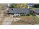 Charming single-story home featuring a gray brick facade, inviting entrance, and well-maintained front yard at 539 N Oneil St, Clayton, NC 27520