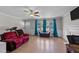 Bright living room with hardwood floors, large windows, and comfortable seating at 539 N Oneil St, Clayton, NC 27520