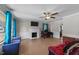 Bright living room featuring hardwood floors, a cozy fireplace, and plenty of natural light at 539 N Oneil St, Clayton, NC 27520