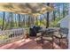 Lovely back deck with outdoor seating and a shade covering, perfect for relaxing at 5508 Lake Garden Ct, Raleigh, NC 27610