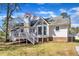 Exterior of home with deck, well maintained backyard at 5508 Lake Garden Ct, Raleigh, NC 27610