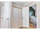 Bright bathroom area with a shower and view through doorway to the main bedroom at 5508 Lake Garden Ct, Raleigh, NC 27610