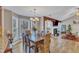 Cozy dining area featuring a chandelier, a dining table, and a view into the living room at 5508 Lake Garden Ct, Raleigh, NC 27610
