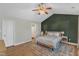 Spacious main bedroom with hardwood floors, decorative rug, and an en-suite bathroom at 5508 Lake Garden Ct, Raleigh, NC 27610