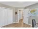 Spacious home office with wood-look floors, closet, and an open door to an adjacent room at 5508 Lake Garden Ct, Raleigh, NC 27610
