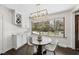 Charming breakfast nook area with built-in cabinets and a view of the backyard at 5705 Dean Ave, Raleigh, NC 27616