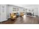Elegant dining room with hardwood floors and large windows, blending classic design with modern comfort at 5705 Dean Ave, Raleigh, NC 27616