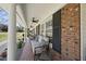 Comfortable front porch with outdoor seating and ceiling fans, perfect for relaxing and enjoying the view at 5705 Dean Ave, Raleigh, NC 27616