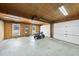 Spacious garage with a lawn mower, offering ample storage and workspace at 5705 Dean Ave, Raleigh, NC 27616