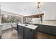 Bright kitchen features dual islands, stainless appliances and an adjacent eat-in nook at 5705 Dean Ave, Raleigh, NC 27616