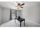 This office has neutral walls, natural light, a ceiling fan, and a dark wood desk at 5705 Dean Ave, Raleigh, NC 27616