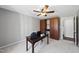 This office features a ceiling fan, storage shelves, and a dark wood desk at 5705 Dean Ave, Raleigh, NC 27616