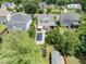 Aerial view featuring a pool, outdoor pergola, manicured yard, and shed in a well-kept neighborhood at 5811 Shawood Dr, Raleigh, NC 27609