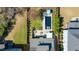 Lovely home site offering a swimming pool, outdoor dining, and beautiful landscaping at 5811 Shawood Dr, Raleigh, NC 27609