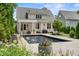 A stunning outdoor space featuring a pristine pool and landscaped backyard at 5811 Shawood Dr, Raleigh, NC 27609