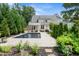Beautiful backyard with a sparkling pool, manicured landscaping, and a spacious patio at 5811 Shawood Dr, Raleigh, NC 27609