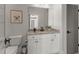 Clean bathroom features a granite vanity, and tile floors at 5811 Shawood Dr, Raleigh, NC 27609