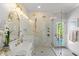 This is a stylish bathroom with modern finishes, a glass-enclosed shower, and access to the patio at 5811 Shawood Dr, Raleigh, NC 27609