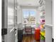 Organized walk-in closet with custom shelving, a built-in desk, and abundant storage solutions at 5811 Shawood Dr, Raleigh, NC 27609