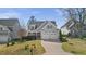 Charming home with a well-manicured lawn, two-car garage, and welcoming curb appeal at 5811 Shawood Dr, Raleigh, NC 27609