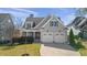 Charming home featuring a two-car garage, and well-maintained landscaping at 5811 Shawood Dr, Raleigh, NC 27609