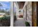 Charming front porch with stone flooring, white columns, and a warm, welcoming atmosphere at 5811 Shawood Dr, Raleigh, NC 27609