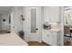 Cozy kitchen nook with white cabinets, marble counters, a stainless steel toaster oven, and a frosted glass door at 5811 Shawood Dr, Raleigh, NC 27609