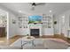 Cozy living room with built-in shelving, fireplace, and comfortable seating at 5811 Shawood Dr, Raleigh, NC 27609