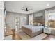 Serene main bedroom with a neutral palette, complemented by a king-size bed and bright natural light at 5811 Shawood Dr, Raleigh, NC 27609