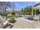 Outdoor patio with a fire pit, dining table, and comfortable seating at 5811 Shawood Dr, Raleigh, NC 27609