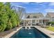 Beautiful backyard featuring an in-ground pool and a well-maintained lawn at 5811 Shawood Dr, Raleigh, NC 27609
