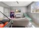 Inviting recreation room featuring a plush couch, arcade game, basketball hoop, and flat screen television at 5811 Shawood Dr, Raleigh, NC 27609