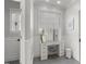 Chic vanity area with lots of drawers, enhanced by natural light and stylish fixtures at 5811 Shawood Dr, Raleigh, NC 27609