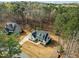 Birds eye view of a beautifully landscaped property featuring a well-manicured lawn, basketball court, and neighboring homes at 76 Gentry Dr, Pittsboro, NC 27312