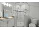 Bright bathroom featuring walk-in shower with glass surround and mosaic tile detail at 76 Gentry Dr, Pittsboro, NC 27312