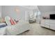 Cozy bedroom featuring light gray walls, white trim, plush carpet, and a cute vanity at 76 Gentry Dr, Pittsboro, NC 27312