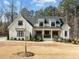 Stunning two-story home features a manicured lawn and welcoming front porch at 76 Gentry Dr, Pittsboro, NC 27312