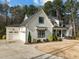 Beautiful two-story home with an attached two car garage and manicured landscaping at 76 Gentry Dr, Pittsboro, NC 27312