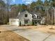 Beautiful two-story home with an attached two car garage and large driveway at 76 Gentry Dr, Pittsboro, NC 27312