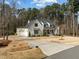 Gorgeous two-story home with an attached two car garage and large driveway at 76 Gentry Dr, Pittsboro, NC 27312