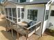 Back of house featuring a deck, screened in porch and grill at 76 Gentry Dr, Pittsboro, NC 27312