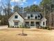 Stunning two-story home features a manicured lawn and welcoming front porch at 76 Gentry Dr, Pittsboro, NC 27312