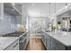Contemporary kitchen with herringbone backsplash, granite countertops, and stainless steel appliances at 76 Gentry Dr, Pittsboro, NC 27312
