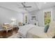Bright main bedroom featuring a sitting area, accent pillows, and white furniture at 76 Gentry Dr, Pittsboro, NC 27312