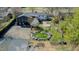 Aerial view of property highlighting the fish pond, patio, and landscaping at 761 S Eighth St, Mebane, NC 27302